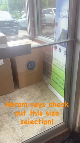 A number of boxes near the front door waiting to be picked up. 