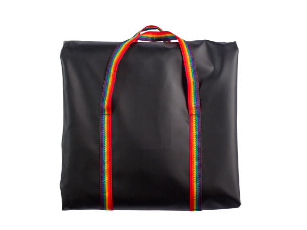 Black tote bag with rainbow straps on a white background